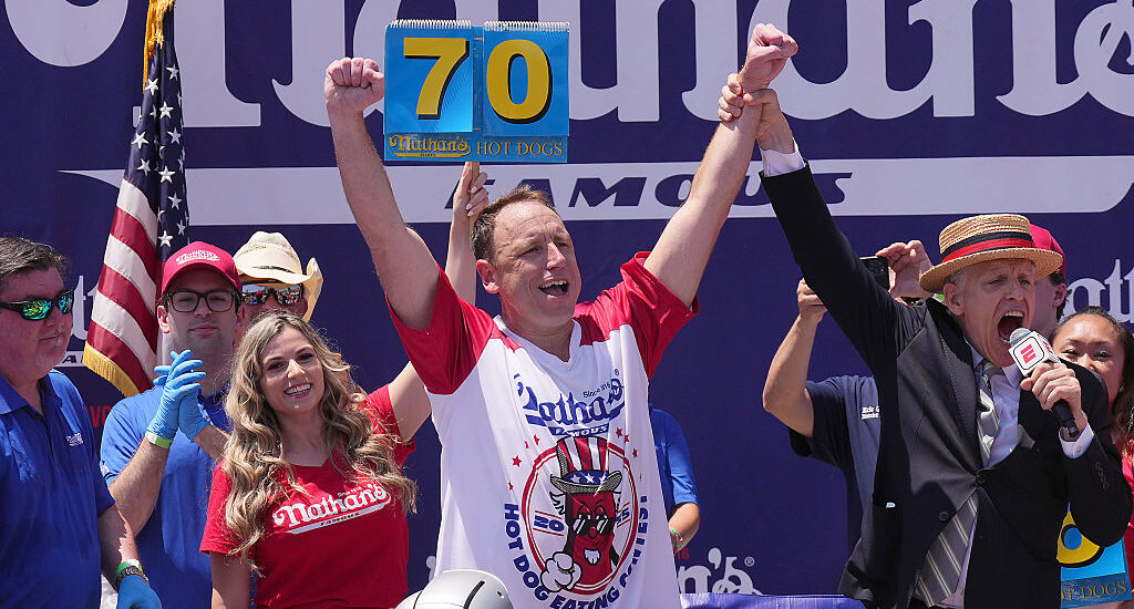 Joey Chestnut celebrating victory at Nathan’s Hot Dog Eating Contest 2025