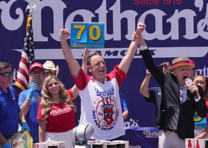 Joey Chestnut celebrating victory at Nathan’s Hot Dog Eating Contest 2025
